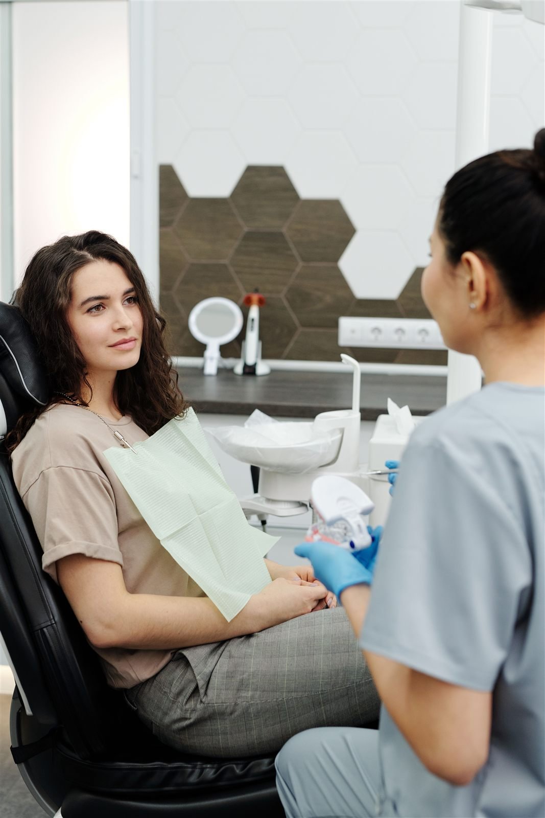 Dentist consulting with a patient